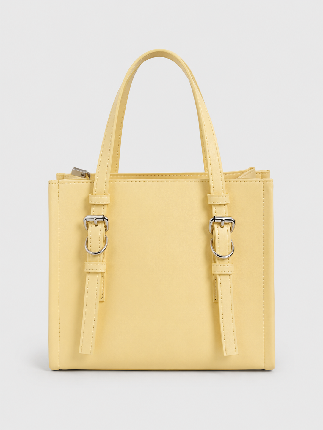 Sac à main élégant avec boucles décoratives