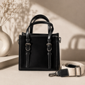 Sac à main élégant avec boucles décoratives